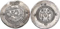 The obverse of a silver-colored coin inscribed in Middle Persian with the name of a sovereign Muslim ruler and Muslim religious formulas on either side of a figural depiction of an ancient Iranian ruler
